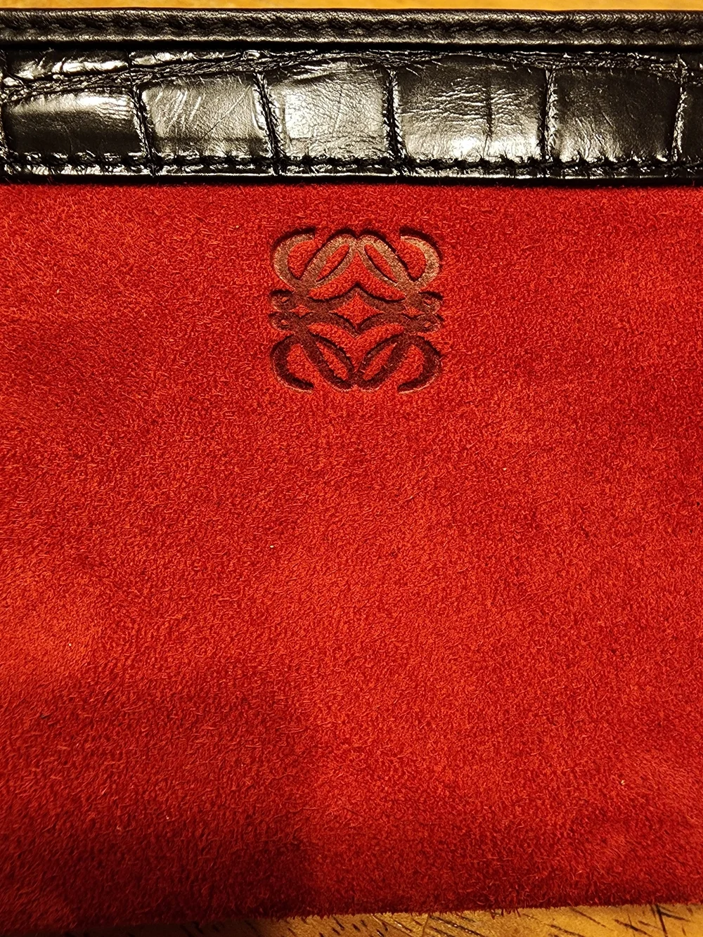 Loewe wallet features  vibrant red suede body & black crocodile Embossed Leather